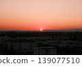sunset over city 139077510