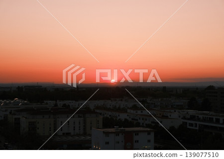 sunset over city sunset over city 139077510