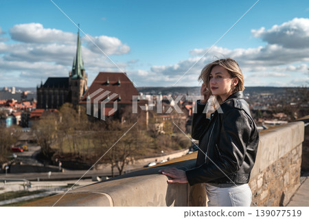 Woman at Scenic European Viewpoint with Historic Church Woman at Scenic European Viewpoint with Historic Church 139077519