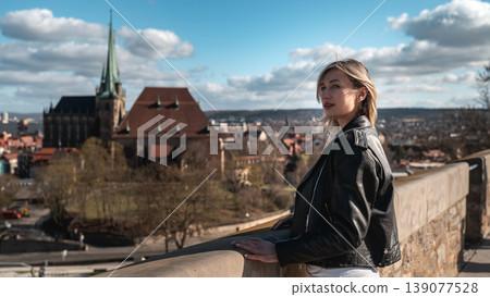 Woman Looking Over European City from Historic Viewpoint Woman Looking Over European City from Historic Viewpoint 139077528