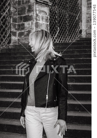 Black and White Portrait of Woman on Historic Cathedral Stairs Black and White Portrait of Woman on Historic Cathedral Stairs 139077548
