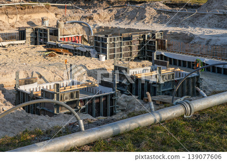 Concrete formwork and foundation structures at construction site with drainage and piping system Concrete formwork and foundation structures at construction site with drainage and piping system 139077606