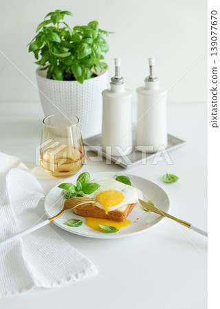 Croque madam sandwich on white wooden table. Croque madam sandwich on white wooden table. 139077670