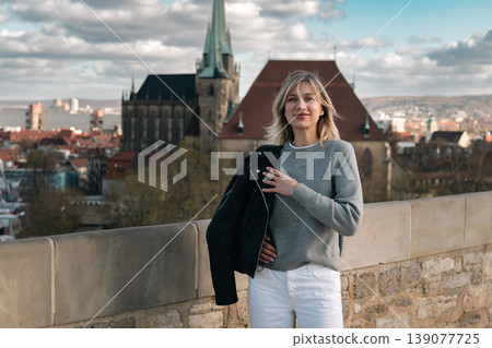 Smiling Woman at Historic European City Viewpoint Smiling Woman at Historic European City Viewpoint 139077725