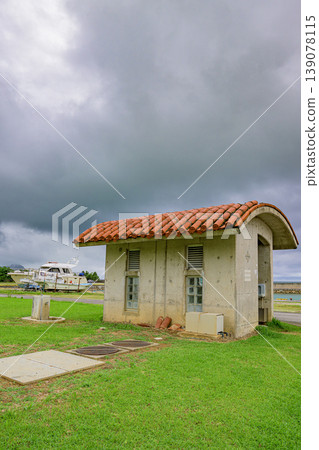 The cloudy sky and the tranquility of the seashore create a memorable scene of the rainy season at Ishigaki Island's port. The cloudy sky and the tranquility of the seashore create a memorable scene of the rainy season at Ishigaki Island's port. 139078115