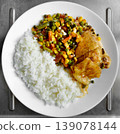 Chicken and rice with mixed vegetables on white plate 139078144