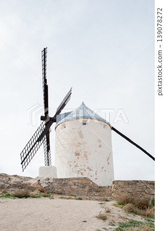 Traditional white windmill with conical roof. Consuegra, Toledo Traditional white windmill with conical roof. Consuegra, Toledo 139078272