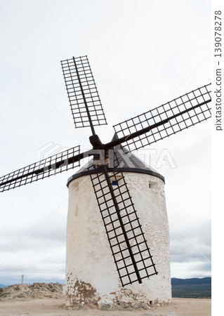White windmill with wooden blades. Consuegra, Spain White windmill with wooden blades. Consuegra, Spain 139078278