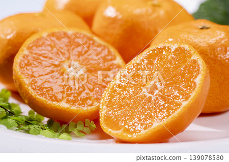 A cross-section of a fresh orange 139078580