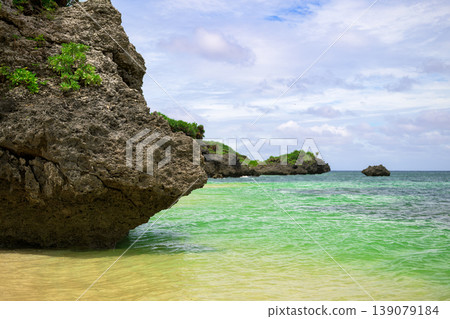 The emerald sea and rocky reefs create a stunning beach in Ishigaki Island. The emerald sea and rocky reefs create a stunning beach in Ishigaki Island. 139079184