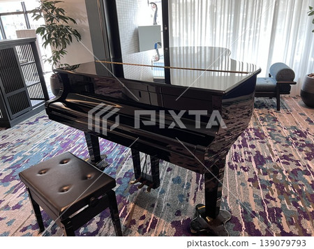 A grand piano in a spacious and bright room A grand piano in a spacious and bright room 139079793