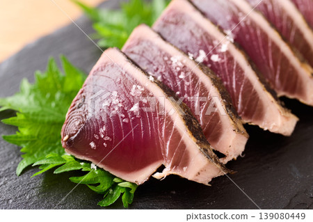 Straw-grilled bonito with coarse salt Straw-grilled bonito with coarse salt 139080449