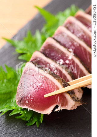Straw-grilled bonito with coarse salt Straw-grilled bonito with coarse salt 139080451
