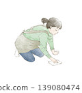 A woman mopping the floor. 139080474