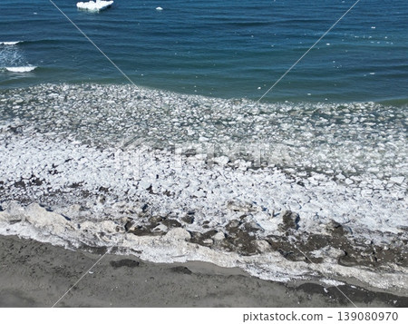 Aerial view of the coastline along the scenic byway with remaining drift ice. Aerial view of the coastline along the scenic byway with remaining drift ice. 139080970
