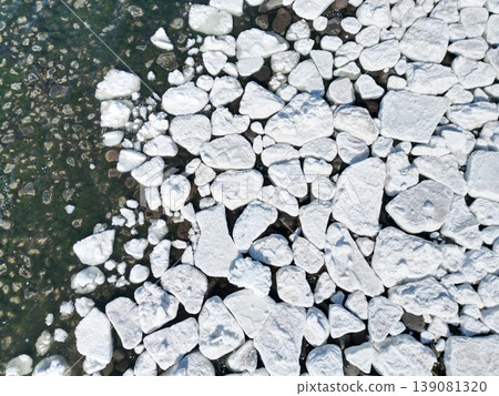 Aerial view of drift ice formations along the coastline of Utoro, Hokkaido. Aerial view of drift ice formations along the coastline of Utoro, Hokkaido. 139081320