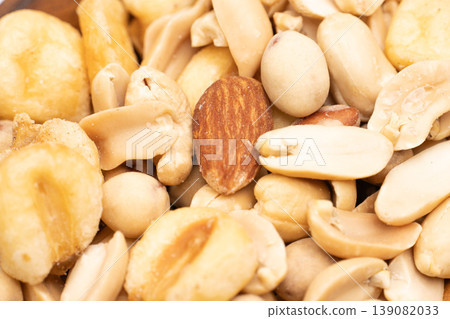 A close-up shot that shows the texture of mixed nuts. 139082033