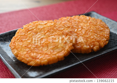 Large fried rice crackers with spicy cod roe filling. Large fried rice crackers with spicy cod roe filling. 139082215