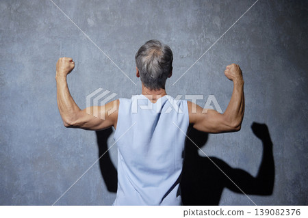 Senior man wearing sportswear posing, back view Senior man wearing sportswear posing, back view 139082376