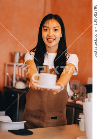 Young woman at barista school learning how to make espresso coffee. 139082796
