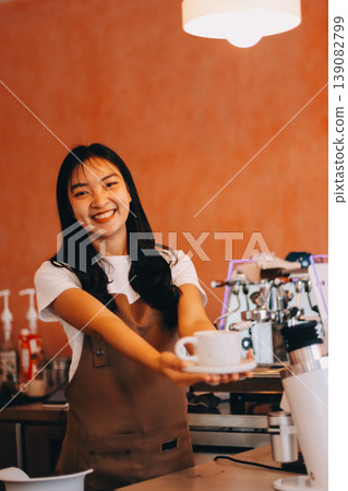 Young woman at barista school learning how to make espresso coffee. 139082799