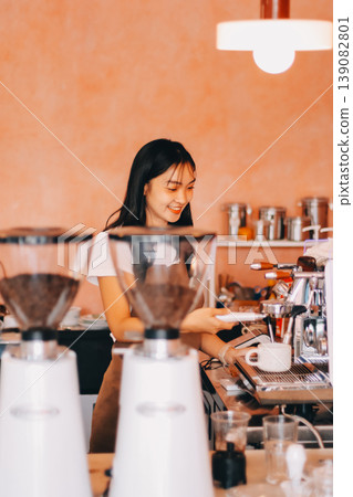Young woman at barista school learning how to make espresso coffee. 139082801