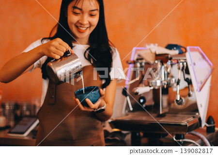Young woman at barista school learning how to make espresso coffee. 139082817