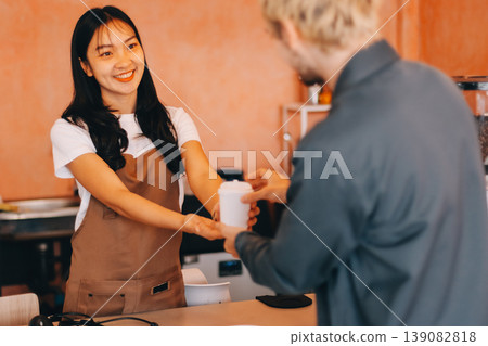 Young woman at barista school learning how to make espresso coffee. 139082818