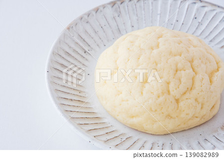 Melon bread on a white plate Melon bread on a white plate 139082989