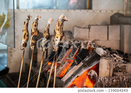 Salt-grilled fish cooked over charcoal Salt-grilled fish cooked over charcoal 139084849