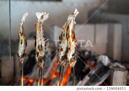 Salt-grilled fish cooked over charcoal 139084851