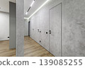 Minimalist Hallway Perspective with Hidden Flush Doors 139085255