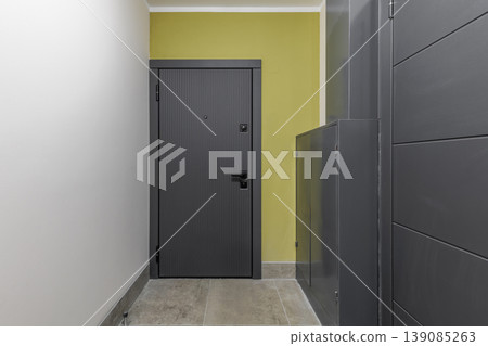 Modern Apartment Entrance with Dark Textured Security Door Modern Apartment Entrance with Dark Textured Security Door 139085263