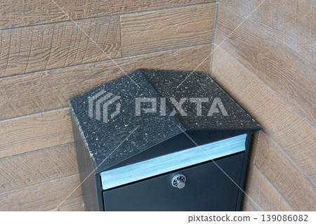 The roof of the post box is stained with yellow dust. The roof of the post box is stained with yellow dust. 139086082