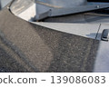 Car hood stained with yellow dust 139086083