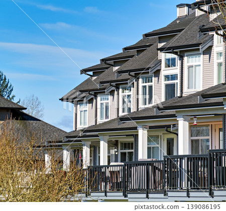 Row of nice residential townhouses on winter day in British Columbia, Canada Row of nice residential townhouses on winter day in British Columbia, Canada 139086195