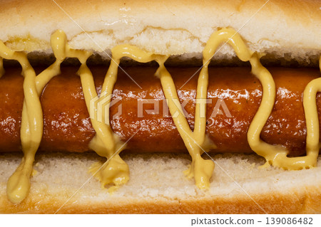Delicious sausage sandwich with mustard topping 139086482
