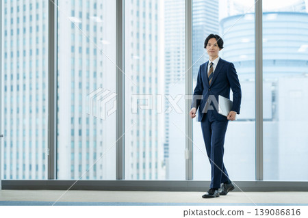 Businessmen working in an office. Filming assistance provided by: Denpa Gakuen Educational Foundation, Tokyo Electronics College. 139086816