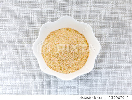 Powdered brown sugar served on a white plate Powdered brown sugar served on a white plate 139087041