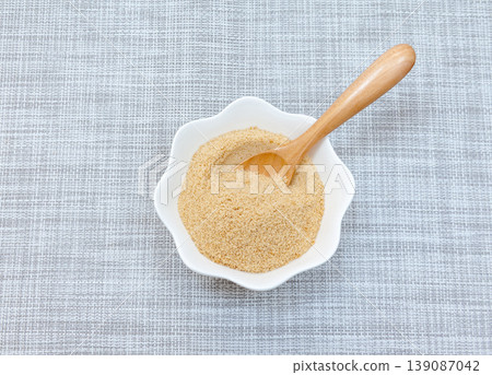 Powdered brown sugar served on a white plate Powdered brown sugar served on a white plate 139087042