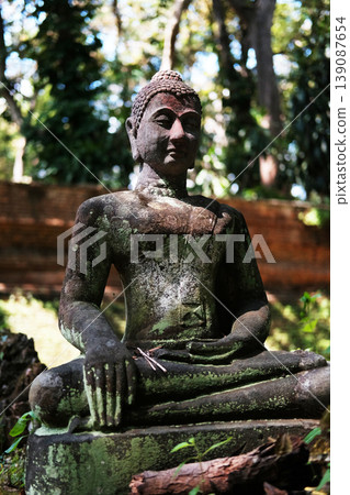 Ancient buddha statue in Wat Umong is ancient temple in Chiang Mai of Thailand 139087654