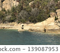 A woman praying on a rock on an island in the Seto Inland Sea 139087953