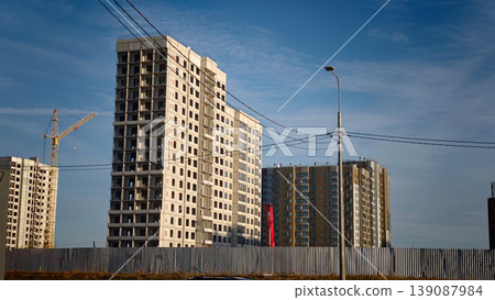 Construction of residential buildings in a city under clear blue sky Construction of residential buildings in a city under clear blue sky 139087984