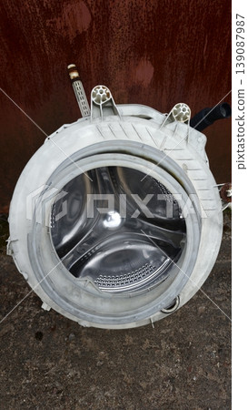 Inside view of a washing machine drum showing the inner structure clearly 139087987