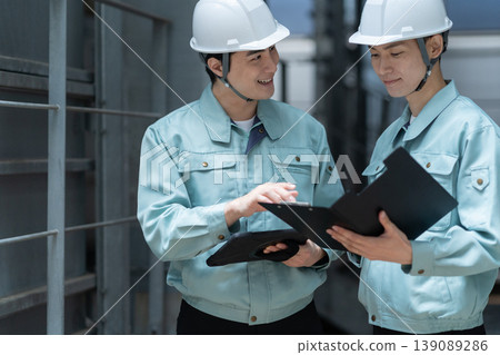 A male engineer performing building maintenance. Photo courtesy of Denpa Gakuen Tokyo Electronics College. A male engineer performing building maintenance. Photo courtesy of Denpa Gakuen Tokyo Electronics College. 139089286
