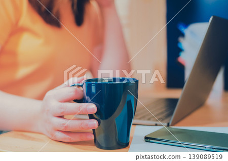 asian woman in casual wear drink coffee and work from home on her bedroom for protect corona or covid-19 virus asian woman in casual wear drink coffee and work from home on her bedroom for protect corona or covid-19 virus 139089519
