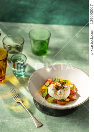 Burrata Caprese salad with heirloom tomatoes and basil Burrata Caprese salad with heirloom tomatoes and basil 139090067