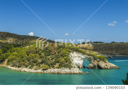 Arco di San Felice rock arch on Apulian coast, Vieste Arco di San Felice rock arch on Apulian coast, Vieste 139090103