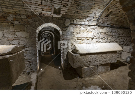 Ancient Roman crypt tunnel with sarcophagi in Ascoli Piceno, Italy 139090120