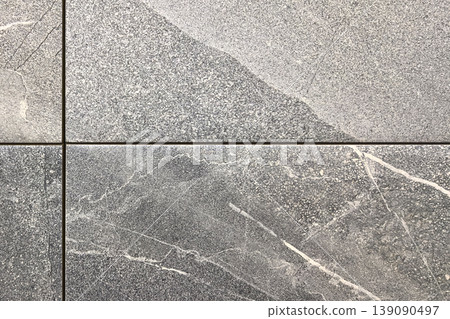 Elegant gray marble tiles showcasing intricate textures and patterns 139090497